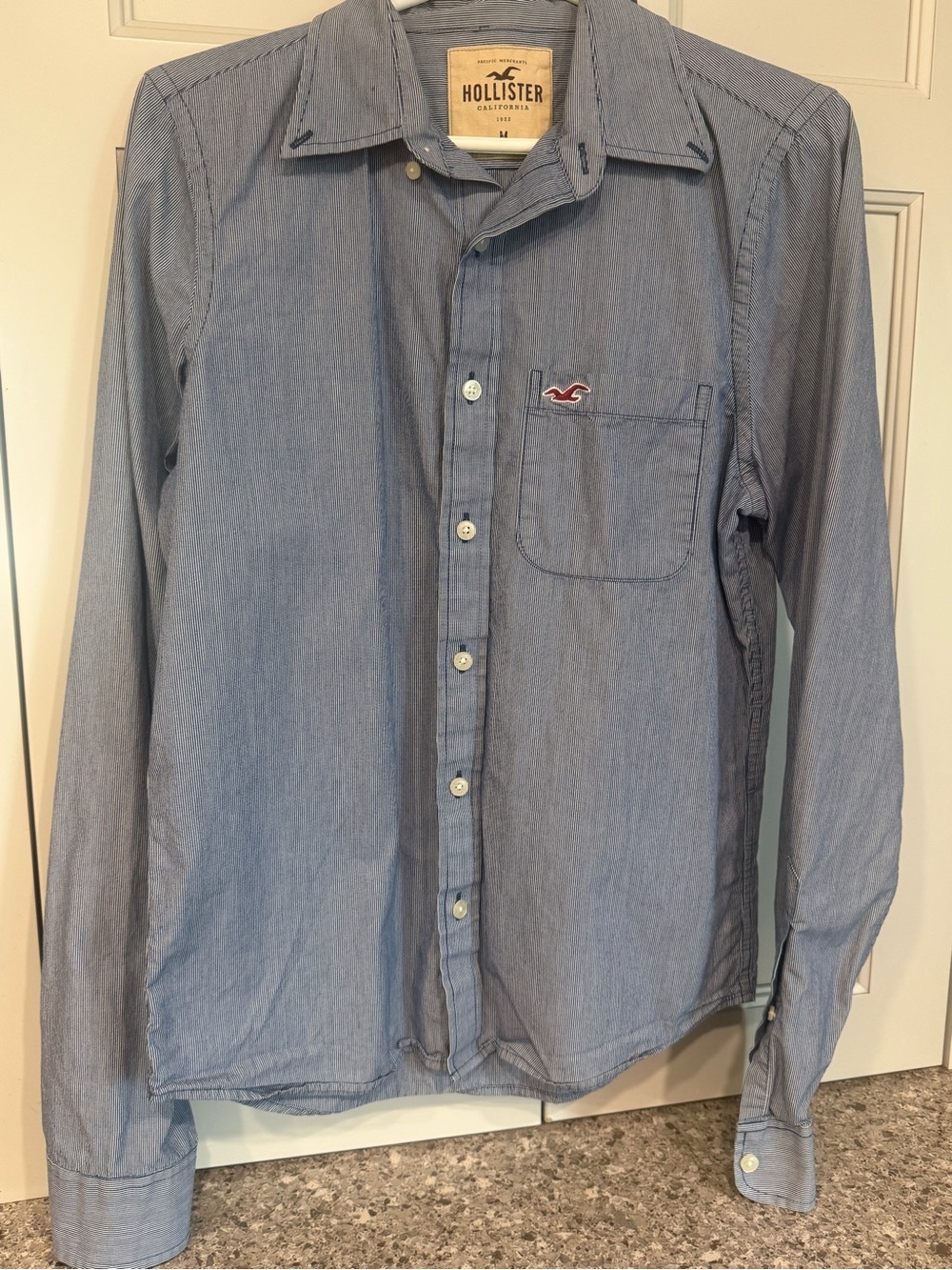Hollister Men's Chambray Button-Down Shirt in Light Blue with Red Logo